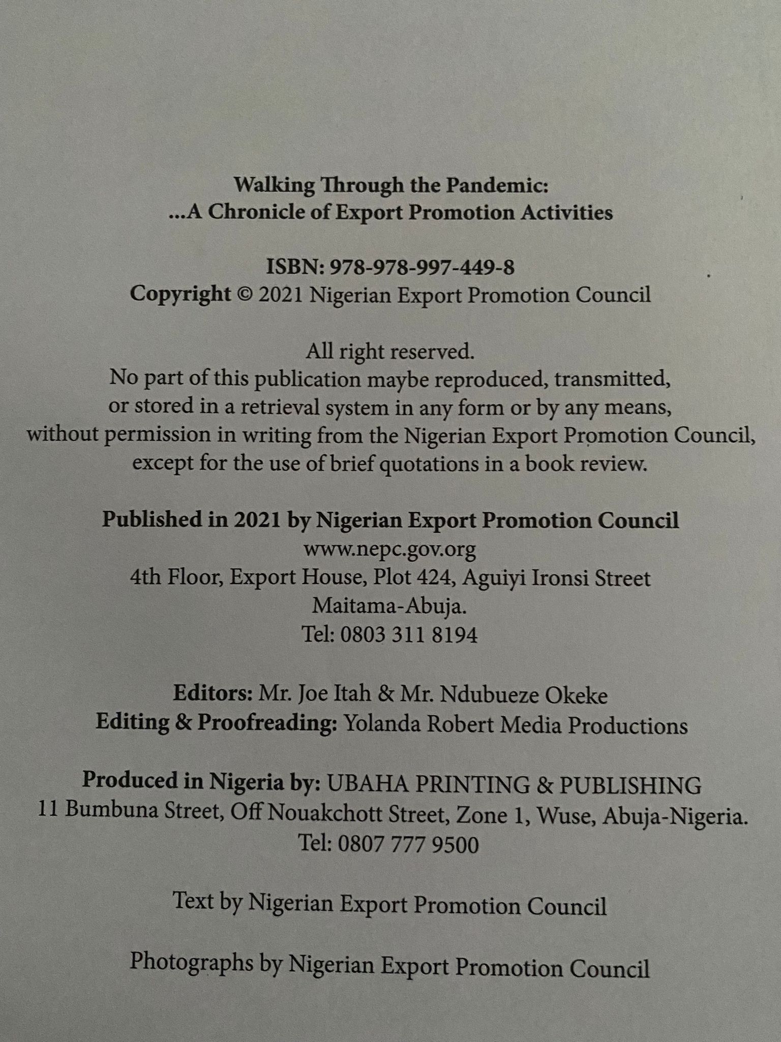 Photograph of the original publication-credit page: Walking Through the Pandemic, ISBN 978-978-997-449-8, listing Editing and Proofreading by Yolanda Robert Media Productions